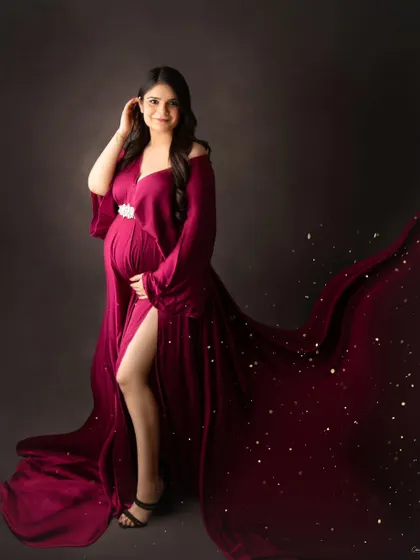 A touch of magic with sparkling lights accenting the flowing train of this beautiful magenta gown.