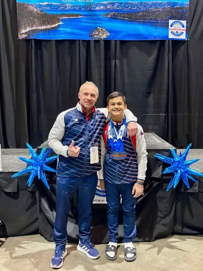 Our Level 8 National Rings Champion, Zachary, with his proud coach after an amazing performance.