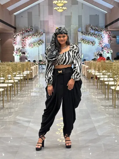 A frontal shot of my zebra-print top and dhoti pants, a bold and stylish choice for a contemporary wedding reception.