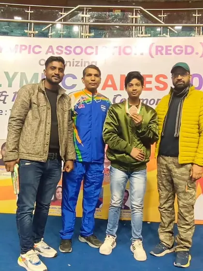 Posing with one of my medal winners at the Delhi Olympic Games.