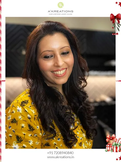 Getting into the festive spirit with this Christmas party look. We created a warm, glowing makeup style and soft curls for a happy, holiday-ready client.