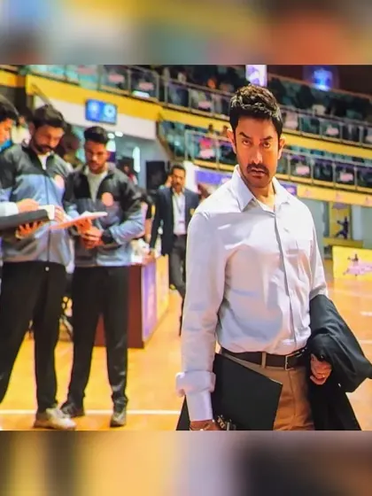 A still from the movie showing me in the background as Aamir Khan's character walks by. I played the role of the opposing team's coach, a surreal moment for our entire academy.