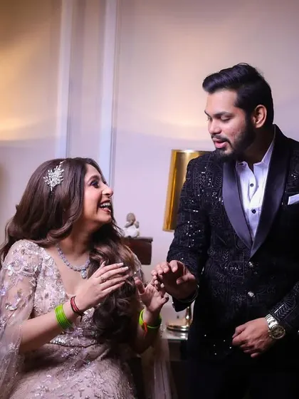 A candid moment of laughter and surprise between the couple during their engagement shoot.