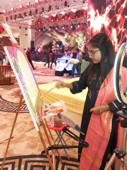 Painting a surprise proposal at The Nikunj, New Delhi. I am positioned to capture the key moment while blending into the background of the beautifully decorated event space.