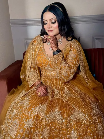 A beautiful candid moment, with the bride's hand delicately touching her chin, showing off her nails and ring.