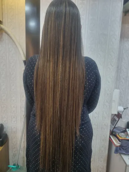 A dramatic before and after. This Kera-smooth treatment completely transformed her frizzy, damaged hair into long, straight, and healthy-looking locks with beautiful highlights.
