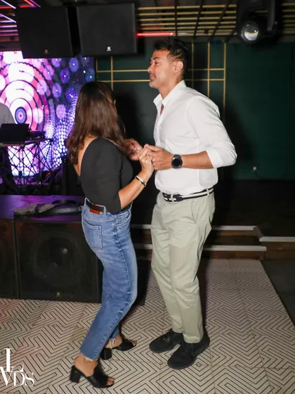 A stylish couple enjoying a Salsa dance. Our open floor is the perfect place to practice your moves and shine.