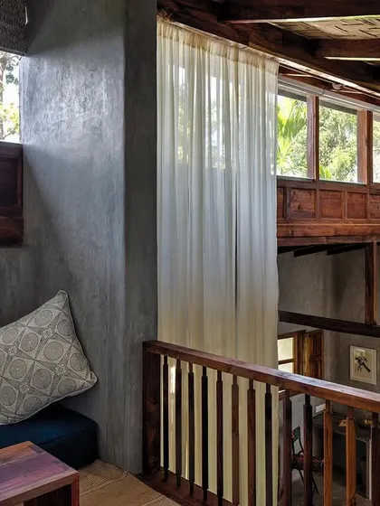 The mezzanine level in the Blue Room, a cozy reading nook tucked away above the main bedroom space.