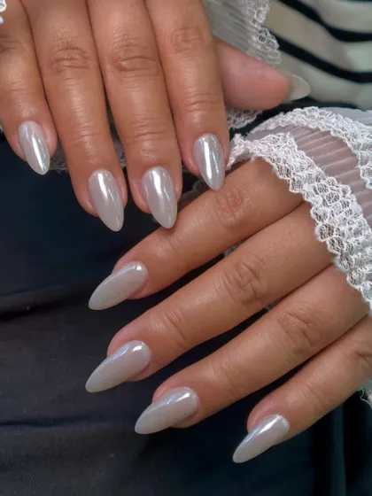 This photo captures the subtle color shifts in the pearly chrome finish, showing hints of pink and silver as the light changes.