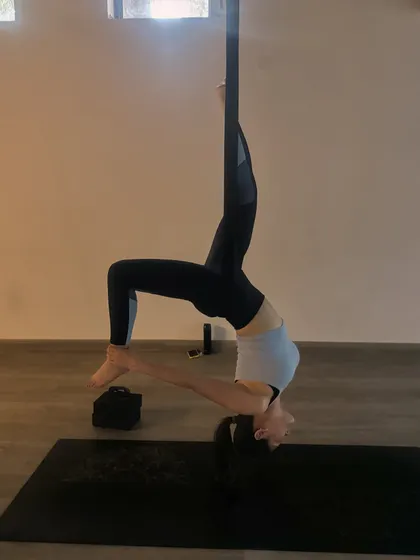 This beautiful supported bridge pose variation opens the chest and shoulders while building strength in the back. The hammock allows for a deeper, more restorative stretch.