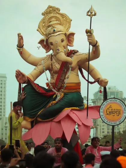 The Chintamani idol seated on a lotus, surrounded by a massive crowd. This image highlights the central role of the idol in the celebration.