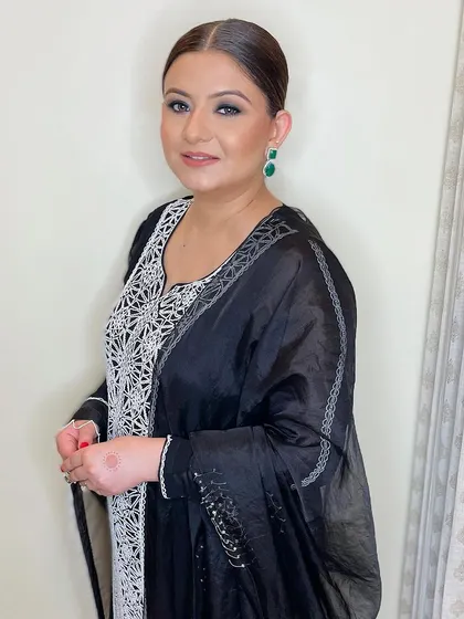 A matte black smokey eye paired with sleek hair for a chic and modern look. This is perfect for a formal dinner or family function.