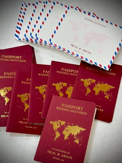 Another look at our passport style wedding invitation, this time in a bold red. It's the perfect choice for any couple planning a destination wedding or with a love for travel.