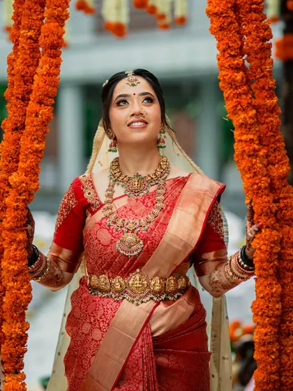 A beautiful upward-looking shot, capturing the bride's happiness and the festive atmosphere.