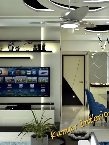 A living room view showing the TV unit with floating shelves and a false ceiling with cove lighting. This project in Thane highlights our ability to create modern and functional living spaces.