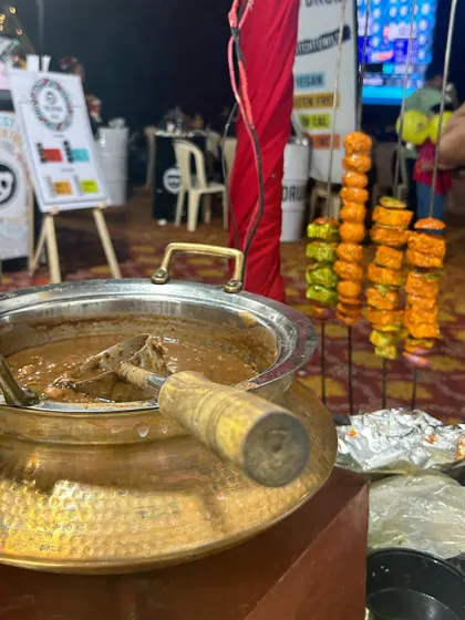 My food stall setup at a pop-up event, featuring a live tandoor station. The combination of delicious Dal Makhani and freshly grilled tikkas always draws a crowd.