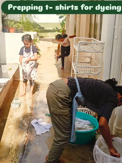 Children wash and prep t-shirts for a tie-dye session, the first step in creating products for their People for Animals fundraiser.