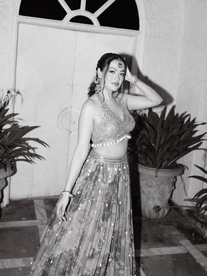 A timeless black and white portrait of the bride, capturing her elegance and style during one of the pre-wedding evening functions.