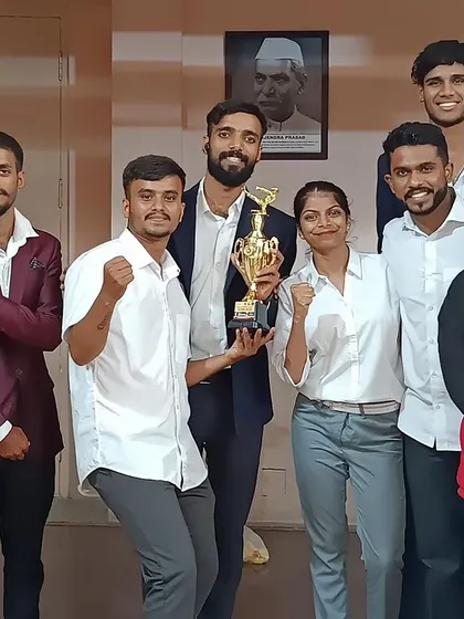 Our team celebrates with a trophy after the 2nd Inter-Dojo UMC Karate Championship in 2023.