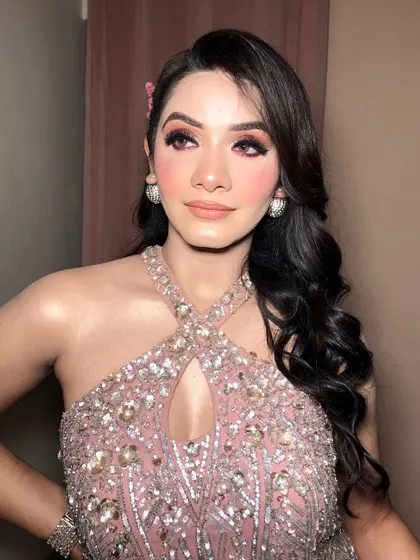 Another angle of this stunning engagement look, highlighting the side-swept Hollywood waves and butterfly hair accessories.