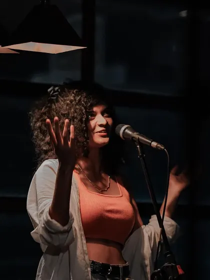 A candid moment of me interacting with the audience during an intimate show. I love making everyone feel like they're part of the music.