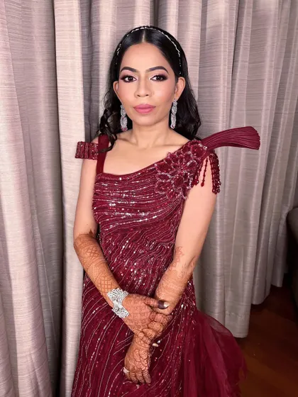 The full look for this chic engagement bride. The Marsala gown, delicate diamond jewelry, and glamorous makeup create a timeless and sophisticated style.