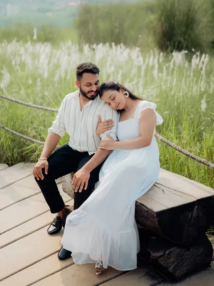 An intimate and tender portrait set against a backdrop of lush greenery. We focus on capturing the quiet, unspoken connection between a couple, resulting in authentic and emotional photographs.