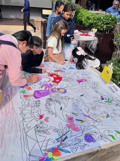 A closer look at the collaborative doodle mat activity. It's a fantastic way for kids to interact, share crayons, and contribute to one big, colorful masterpiece.