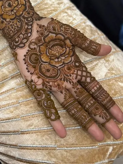 A detailed close-up of a floral Arabic design on the palm.