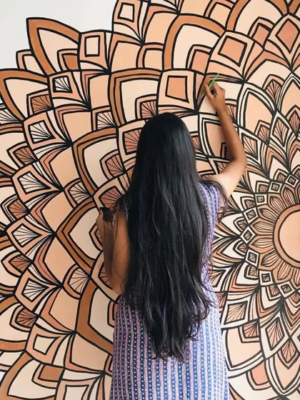 Adding details to a half mandala in earthy brown tones. I love how the different shades create a sense of depth.