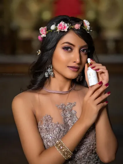 A similar shot from the same campaign, focusing on the product and the model's serene expression.