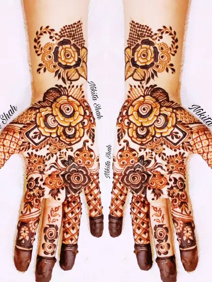 I love blending styles, and this Indo-Western design is a great example. It combines bold rose florals with delicate traditional patterns for a look that is modern, elegant, and perfect for any party or sangeet.