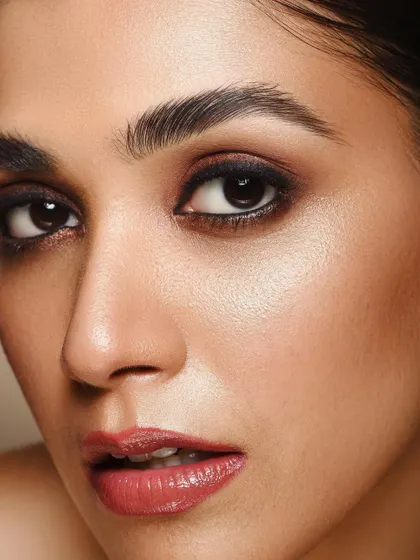 A powerful and direct shot from the 'Kaia' series. The focus is entirely on the eyes and the expert makeup, showing how lighting can be used to create depth and intensity in a beauty portrait.