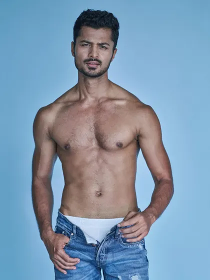 A classic denim and bare-chest look. This is a timeless and versatile shot for any male model's portfolio.