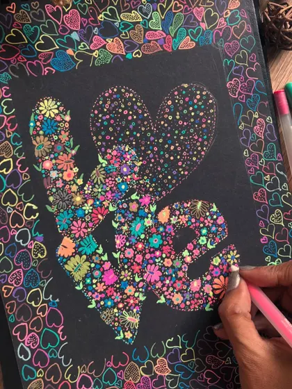 A close-up of the "LOVE" floral doodle, showing the detail of each flower.