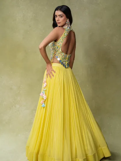 A back-profile shot showing the stylish design of a modern lehenga blouse. This is an important shot for e-commerce and lookbooks.