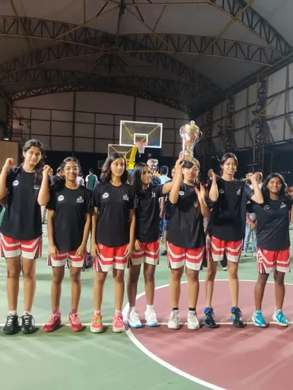 The MCHS U16 Girls team from our academy holding their trophy after a strong performance at the State U16 Youth Basketball Championship.