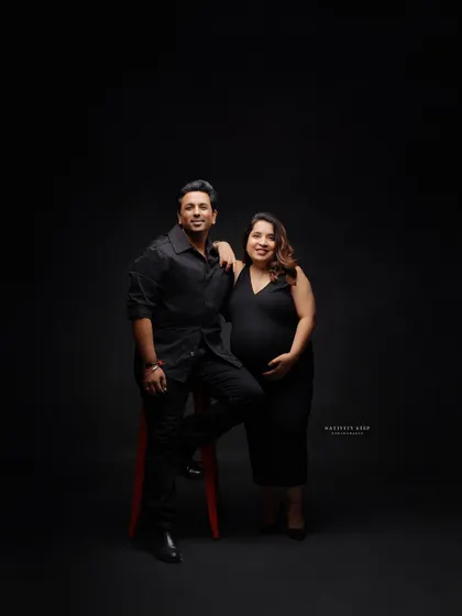 A stylish and confident pose from the parents-to-be. This shot has a modern and cool vibe, perfect for capturing your personality as a couple.