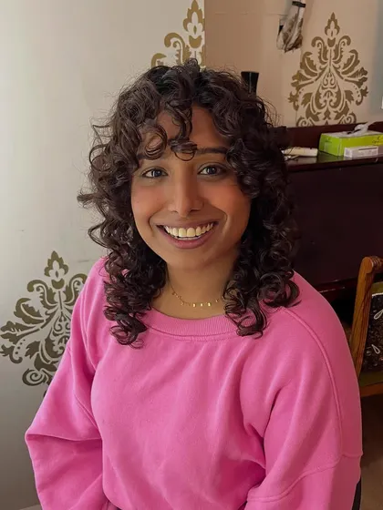 A fun and bouncy curly shag for Saniya, complete with a fringe to frame her face.