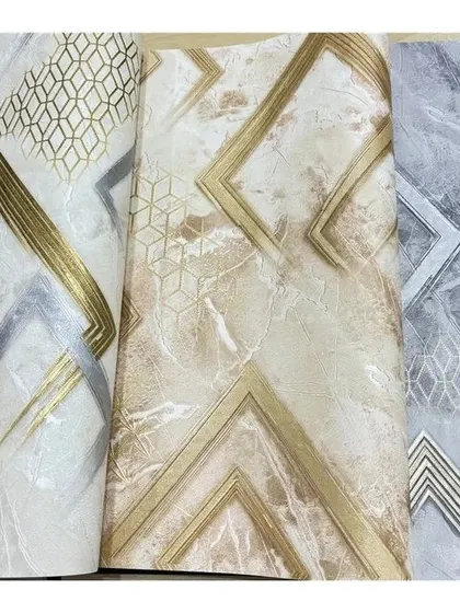 A close-up of three different geometric wallpaper rolls, showcasing various patterns and metallic finishes.