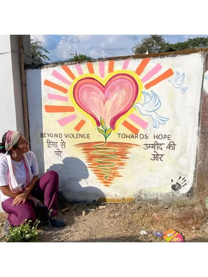 A quiet moment with my "Beyond Violence, Towards Hope" mural in Seijosa. This piece was about starting a journey of activism with a message of peace.
