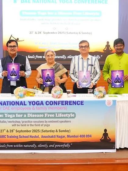 Unveiling literature on yoga alongside other distinguished guests at the 8th DAE National Yoga Conference.
