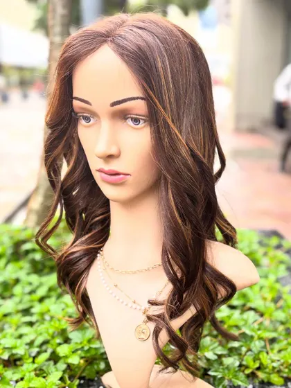 A mannequin shot of the creamy blonde wig, showing how the color and style frame the face beautifully.