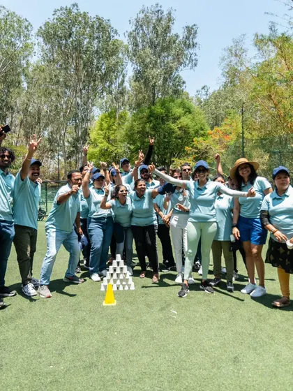 The pure joy of victory. A corporate team celebrates after successfully completing a team building challenge.