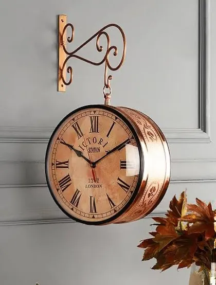 The warm tones of this copper-finished station clock make it a cozy addition to a hallway or study.