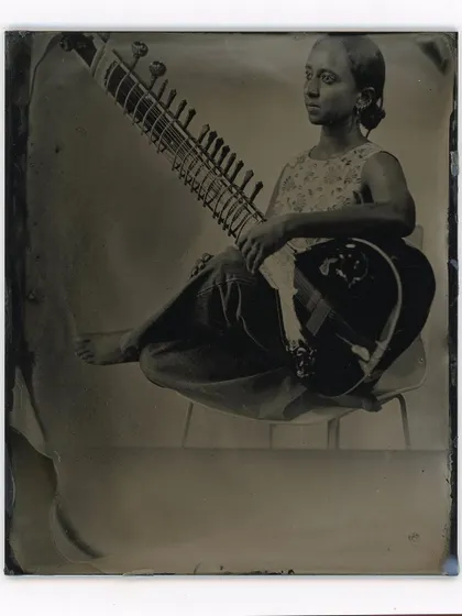 A musician and her sitar, immortalized on a glass plate through the historic ambrotype process, a service we proudly offer at Kānike.