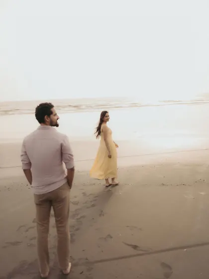 A candid moment of him watching her by the sea. These unposed shots often tell the most beautiful stories.