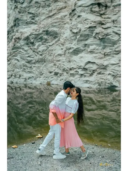 A duplicate of ID 26, this fun and energetic shot by the water captures the couple's happy and carefree spirit.