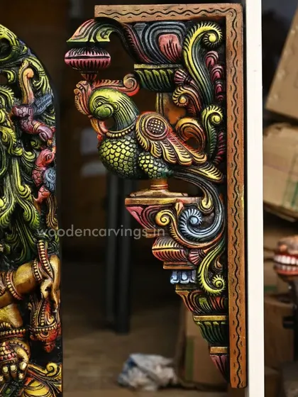 A close-up of the 24-inch multicolored Annapakshi (Hamsa bird) wall bracket, showcasing the vibrant painting and detailed carving of the mythical bird.