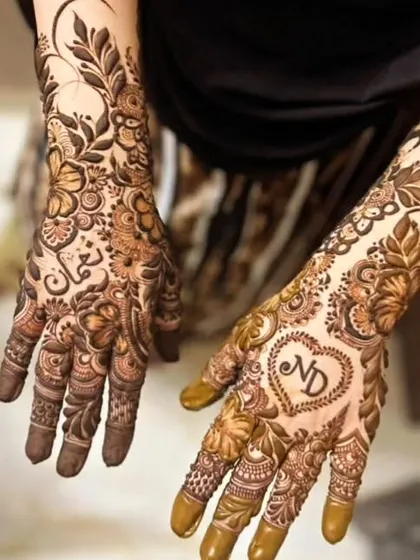 I love creating modern Arabic and Dubai style henna. This design combines a bold floral vine with the couple's initials, ND, inside a heart. It's elegant, personal, and leaves beautiful negative space on the skin.
